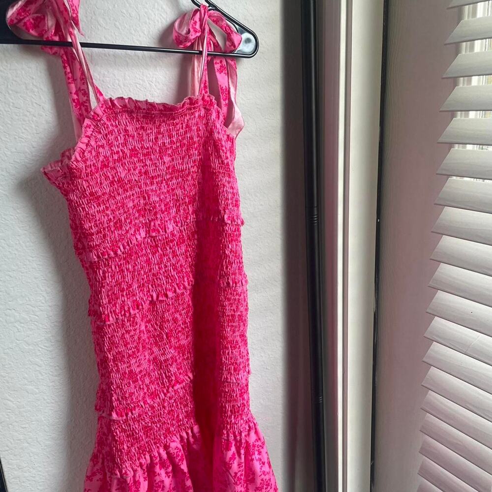 Pink lace mini dress with ruffles